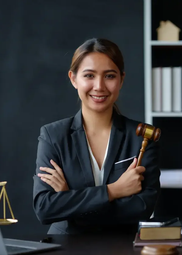 lawyer at desk with gavel, scales and laptop